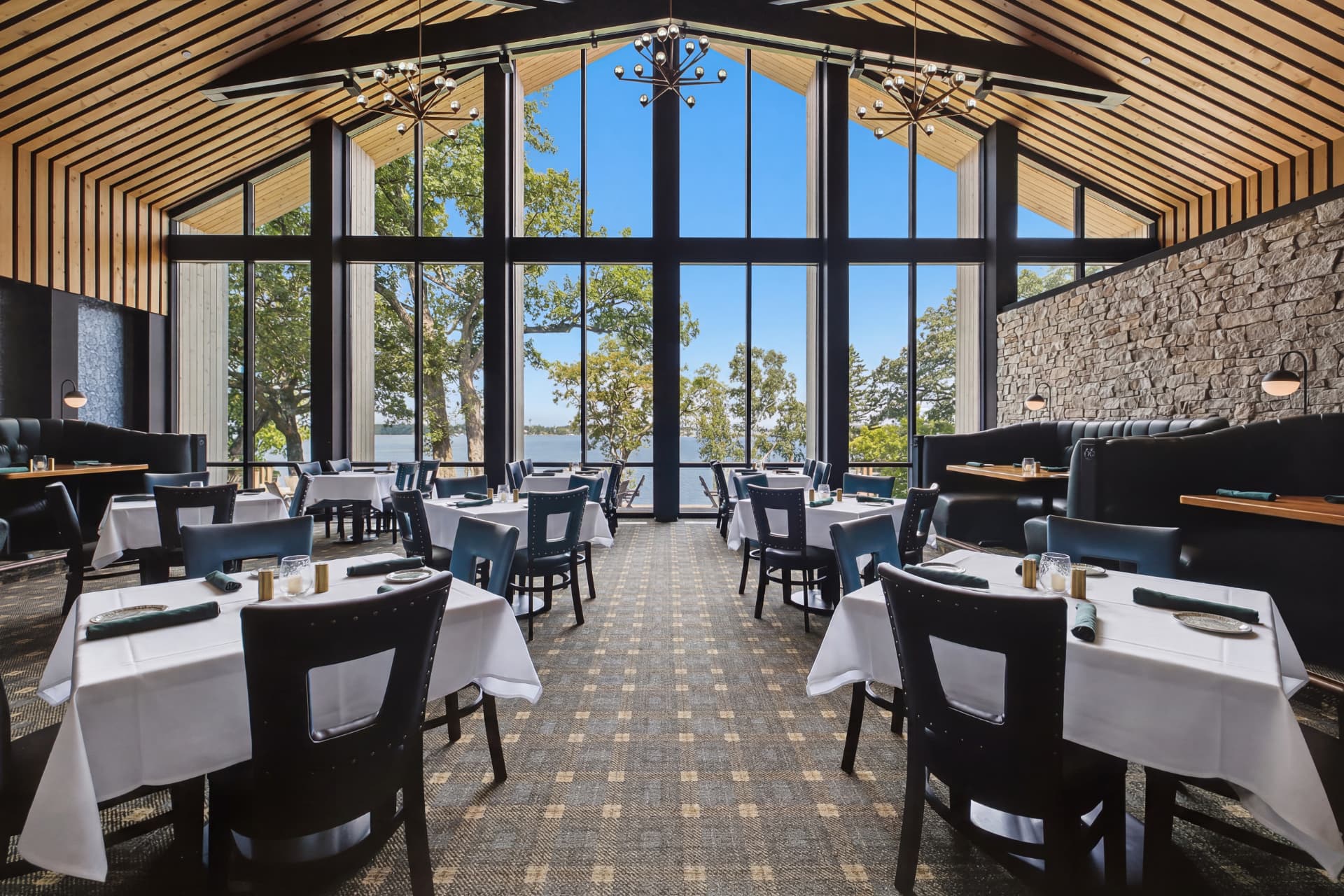 The Fairchild dining room with vaulted ceiling and lake views